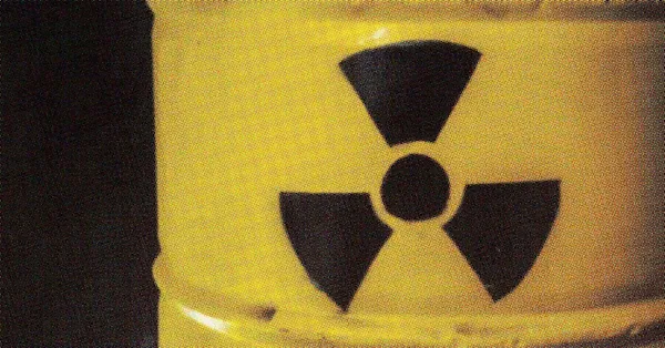 Yellow barrel with a black radioactive symbol.
